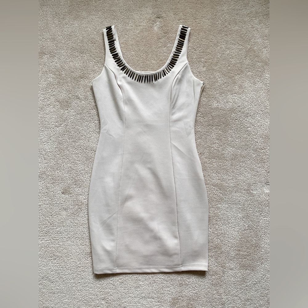Beige cream lined dress with wooden accents, open back hole, and side zipper